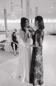 Mother of bride and bride having a special moment after getting into dress. Authentic, genuine, documentary style wedding photos.