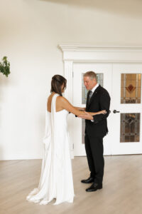 First look with dad on wedding day.